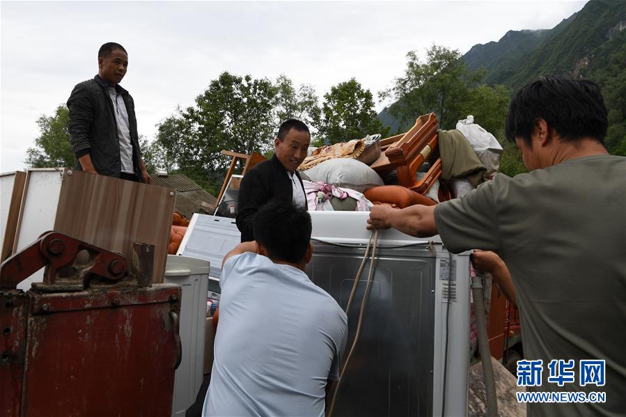 （新華全媒+）（9）千里“挪窩”，踏實開啟新生活