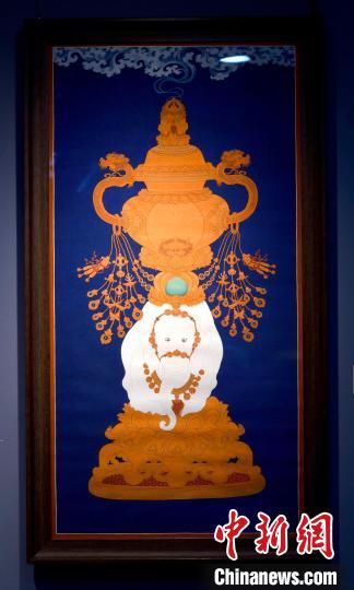 圖為5月16日，展覽中的新創(chuàng)唐卡作品《瑞象承香》?！±盍?攝